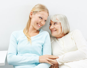 elder and staff smiling